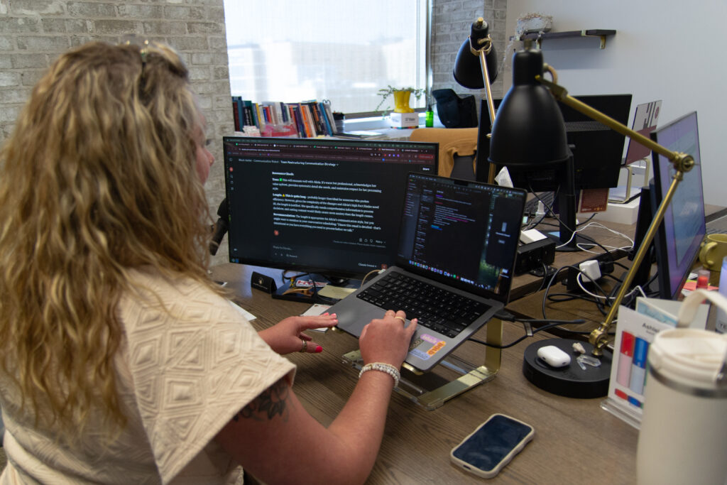 Ashlei Rolloff, founder of Nerd Herd, working at her laptop